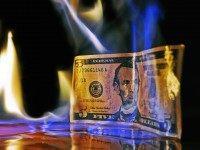Dollar on fire (Mike Poresky / Flickr / CC / Cropped)