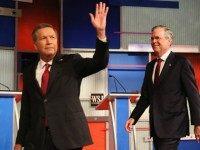 Presidential candidates Ohio Governor John Kasich (L-R) and Jeb Bush take the stage at the Republican Presidential Debate sponsored by Fox Business and the Wall Street Journal at the Milwaukee Theatre November 10, 2015 in Milwaukee, Wisconsin. The fourth Republican debate is held in two parts, one main debate for the top eight candidates, and another for four other candidates lower in the current polls. (Photo by