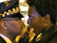 Lamon Reccord, right, stares and yells at a Chicago police officer Charles Rex Arbogast, AP