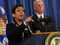 Attorney General Loretta Lynch (L) calls on reporters after announcing a major civil settlement with U.S. Attorney for the Western District of Pennsylvania David Hickton at the Justice Department November 16, 2015 in Washington, DC.