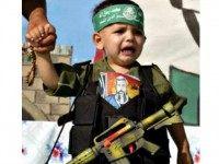Reuters Beit Hanoun village in northern Gaza, crying child with gun