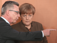 Thomas de Maiziere and German Chancellor Angela Merkel