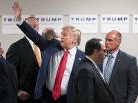 Republican presidential candidate Donald Trump waves to guests as he leaves a rally at Des Moines Area Community College Newton Campus on November 19, 2015 in Newton, Iowa. Trump is currently leading the race for the Republican presidential nomination in Iowa. (Photo by )
