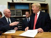 Republican presidential candidate Donald Trump files for the New Hampshire state ballot as New Hampshire Secretary of State William Gardner (L) looks on, November 4, 2015 in Concord, New Hampshire. AFP PHOTO/DON EMMERT (Photo credit should read