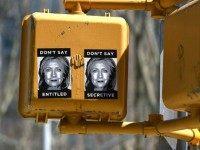 Anti-Hillary Clinton posters are seen on a sign post in Brooklyn on April 16, 2015, just blocks from Clintons new Brooklyn , New York 2016 presidential campaign headquarters . The posters feature illustrations of Clintons face along with slogans, including: Dont Say Secretive and Dont Say Entitled. AFP PHOTO / TIMOTHY A. CLARY (Photo credit should read