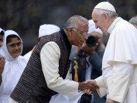 Pope Francis (R) greets people of different religions at the end a weekly general audience for interfaith relations at St Peter's square on October 28, 2015 at the Vatican. Today marks the 50th anniversary of the Church's 'Nostra Aetate' declaration which challenged religious prejudices and urged bridge building with other faiths. A special papal audience for interfaith relations was celebrated in Saint Peter's Square to remember the moment on October 28, 1965, when Paul VI adopted what was a ground-breaking declaration lambasting anti-Semitism in particular. AFP PHOTO / FILIPPO MONTEFORTE (Photo credit should read