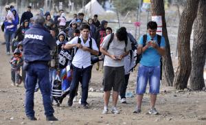 Swedish official tears up as 'open-door' asylum policy is reversed