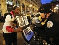 Protesters shut down Chicago shopping district, demand federal probe in McDonald shooting