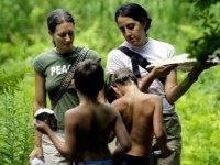 Program Co-Director Lannie Moore (L) and Instructor Laura Kaplan (R) walk with students after making plaster casts of animal tracks at the Center for Attention and Related Disorders? (C.A.R.D.) camp at the Great Hollow Wilderness School July 29, 2003 in New Fairfield, Connecticut. The four-week camp boasts one instructor for every two campers and provides the structure, discipline, and social order necessary for children who suffer from Attention Deficit Hyperactivity and similar disorders. The C.A.R.D. program has only 39 students and the unique program?s high cost of $600 a week per student is out of reach for many and the cost is supplemented by scholarships, grants, and private donations. (Photo by