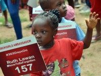 A young girl carries a placard with a name of a girl as family and friends mark 500 days since the abductions of Chibok schoolgirls by Boko Haram militants during a rally to press for their release in Abuja, on August 27, 2015. Relatives of over 200 Nigerian schoolgirls kidnapped by Boko Haram militants marked 500 days on Thursday since the abductions, with hope dwindling for their rescue despite a renewed push to end the insurgency. AFP PHOTO/STRINGER (Photo credit should read -/)