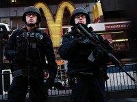 New York police officers with high powered rifles patrol in Times Square on December 7, 2015 in New York City. Following a series of mass shootings in the U.S. and the terrorist attacks in Paris last month, security in many major American cities has increased while gun sale background checks are at an all time high. (Photo by