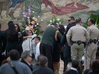 amily members hug near the casket of 27-year-old Yvette Velasco at the first funeral for victims of the December 2 massacre in San Bernardino on December 10, 2015 in Covina, California. Velasco was attending a holiday luncheon at the Inland Regional Center on December 2 when Syed Farook and Tashfeen Malik entered the room heavily armed and opened fire, killing 14 people and injuring 21 others. (Photo by)