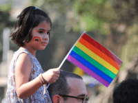 Caption:A girl looks on during the 'Queer Azadi March' freedom march for lesbian, gay, bisexual and transgender supporters, in Mumbai on January 29, 2011. In July 2009, Delhi High Court decriminalised gay sex between consenting adults by declaring a colonial-era ban on homosexuality unconstitutional. AFP PHOTO Sajjad HUSSAIN (Photo credit should read SAJJAD HUSSAIN/AFP/Getty Images)