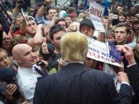 Republican presidential candidate Donald Trump greets guests at a campaign rally on December 21, 2015 in Grand Rapids, Michigan. The full-house event was repeatedly interrupted by protestors. Trump continues to lead the most polls in the race for the Republican nomination for president. (Photo by )