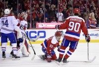 Evgeny Kuznetsov, Marcus Johansson, Mike Condon
