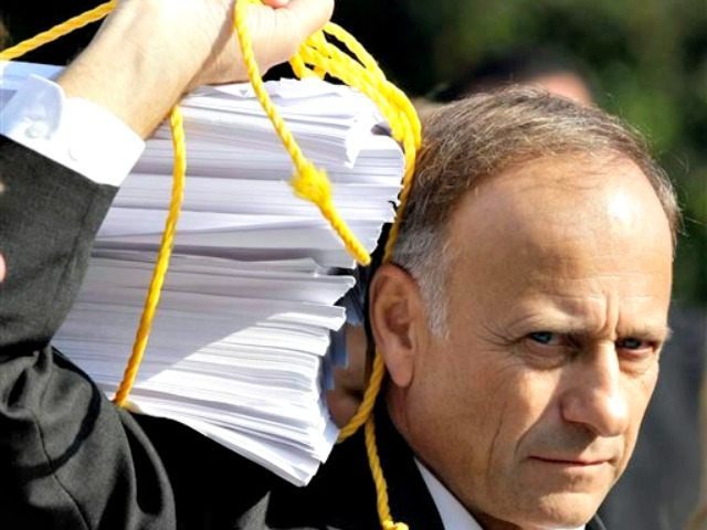 steve-king with sheaf of papers AP