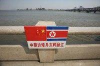 China extols North Korea's Kim Jong Il, denies reports of arrests