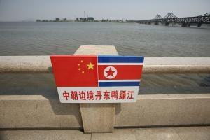 China extols North Korea's Kim Jong Il, denies reports of arrests