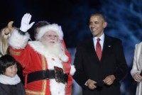 Obamas send holiday greetings; first lady helps track Santa