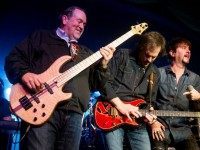 Republican presidential candidate former Arkansas Gov. Mike Huckabee, left, plays bass guitar as he performs with the 80's rock band FireHouse at the Surf Ballroom in Clear Lake, Iowa, Friday, Jan. 22, 2016. In 2008, Huckabee performed at the ballroom, made famous for being the last venue Buddy Holly played before dying in a plane crash in 1959. (