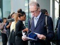 Job hunters line up for interviews at an employment fair sponsored by the New York State Department of Labor, Wednesday, Oct. 8, 2014.