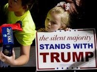 A young girl stands at the rope line as Republican presidential candidate Donald Trump greets members of the audience after speaking at a rally at Muscatine High School in Muscatine, Iowa, Sunday, Jan. 24, 2016. ()