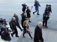 Tonya Couch, bottom center, the mother of a Texas teen who used an "affluenza" defense in a drunken wreck, leaves Tarrant County Jail, Tuesday, Jan. 12, 2016, in Fort Worth, Texas. She is to be fitted with a GPS monitor before release. A judge decreased Couch's bond Monday from $1 million to $75,000. Couch is charged with hindering the apprehension of a felon after she and her son, Ethan Couch, were caught in a Mexican resort city. (AP Photo/Brandon Wade)