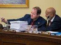 House Rules Committee members Rep. Jared Polis, D-Colo., center, and Rep. Alcee Hastings, D-Fla., right, pose for a selfie with a large printout of the $1.1 trillion omnibus spending bill as it arrives at the panel for consideration, at the Capitol in Washington, Wednesday, Dec. 16, 2015. The bill will fund the government for the 2016 budget year and extend $680 billion in tax cuts for businesses and individuals. President Barack Obama is expected to sign the legislation. (