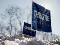 Signs for Republican presidential candidate, New Jersey Gov. Chris Christie are posted in the snow, Monday, Jan. 25, 2016, in Greenland, N.H.