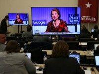 Republican Presidential candidate Carly Fiorina is seen on a television screen as reporters watch the debate during the Republican Presidential debate sponsored by Goggle and Fox News at the Iowa Events Center on January 28, 2016 in Des Moines.