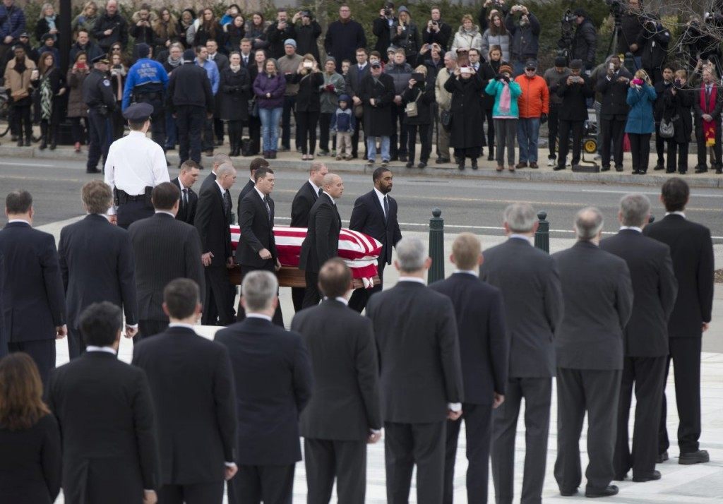 Pallbearers carry the flag-draped casket containing the body of Justice Antonin Scalia into the upreme Court in Washington, Friday, Feb. 19, 2016. Thousands of mourners will pay their respects Friday for Justice Antonin Scalia as his casket rests in the Great Hall of the Supreme Court, where he spent nearly three decades as one of its most influential members. (AP Photo/Manuel Balce Ceneta)