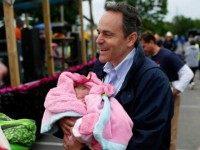 Kentucky Republican senatorial candidate Matt Bevin holds newsborn Mary Halston Brandon at the Fountain Run BBQ Festival while campaigning for the Republican primary May 17, 2014 in Fountain Run, Kentucky.
