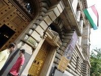 Local citizens walk in front of the headquarters of the Hungarian National Bank (MNB) in downtown Budapest on June 7, 2010. Hungary's new government pledged to keep its finances under control today after comments by senior officials the country was broke rocked the markets, the euro and investor confidence. AFP PHOTO / ATTILA KISBENEDEK (Photo credit should read ATTILA KISBENEDEK/AFP/Getty Images)