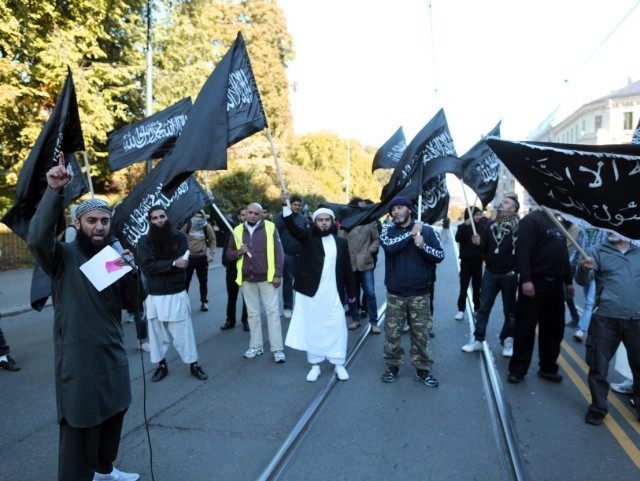 Norwegian Muslims demonstrate outside the US Embassy in Oslo on September 21, 2012 to protest against the US-made film "Innosence of Muslims". Fresh protests erupted across the Muslim world on September 21 against a US-made film and French cartoons mocking Islam, with violent demonstrations in Pakistan leaving at least 13 people dead. In Middle Eastern and Asian countries tens of thousands took to the streets after the main weekly prayers to vent their anger, with little sign that the angry protests which began 11 days ago would abate.   AFP PHOTO / NTB scanpix / Kyrre Lien        (Photo credit should read Lien, Kyrre/AFP/GettyImages)