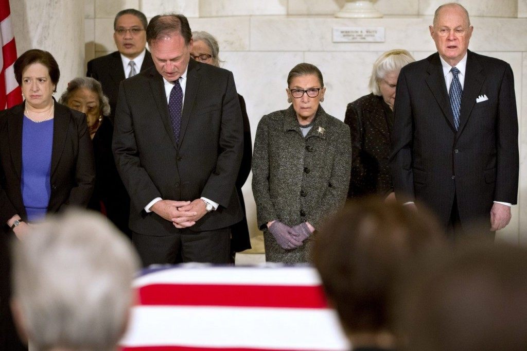 Supreme Court Justices Elena Kagan, left, Samuel Anthony Alito, Jr., Ruth Bader Ginsburg, and Anthony M. Kennedy react during prayers at a private ceremony in the Great Hall of the Supreme Court where late Supreme Court Justice Antonin Scalia lies in repose on February 19, 2016 in Washington, DC. (Photo by Jacquelyn Martin/Getty Images)
