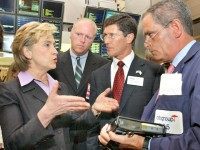 U.S. Sen. Hillary Rodham Clinton, D-NY, left, U.S. Rep Joe Crowley, D-NY, second left, New York Stock Exchange chief executive John Thain, and NYSE trader Robert Keenan, right, discuss electronic trading on the NYSE trading floor, Tuesday Aug. 3, 2004. In a filing made Monday with the U.S. Securities and Exchange Commission, the NYSE said it wants to give stock traders the option to have their trades executed electronically, no matter the price or number of shares involved, while still providing the option for a floor-based auction run by specialists that the exchange says often results in price improvement for both parties. (AP Photo/Richard Drew)
