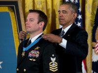 President Barack Obama presents the Medal of Honor to Senior Chief Special Warfare Operator Edward Byers during a ceremony in the East Room of the White House in Washington, Monday, Feb. 29, 2016. Byers received the Medal of Honor for his courageous actions while serving as part of a team that rescued an American civilian being held hostage in Afghanistan on December 8-9, 2012. (AP Photo/Carolyn Kaster)