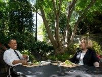 In this handout provided by the White House, U.S. President Barack Obama has lunch with former Secretary of State Hillary Rodham Clinton on the patio outside the Oval Office, July 29, 2013 in Washington, D.C.