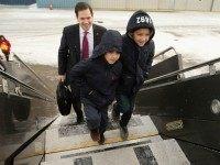 Republican presidential candidate Sen. Marco Rubio (R-FL) and his sons Anthony and Dominick walk across the tarmac before departing from Manchester-Boston Regional Airport February 10, 2016 in Manchester, New Hampshire.