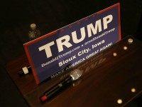 Republican presidential candidate Donald Trump's microphone is seen near a campaign sign as he attends a campaign rally at the Sioux City Orpheum Theatre on January 31, 2016 in Sioux City, Iowa. Trump and other presidential hopefuls are in Iowa trying to gain support and crucial votes for tomorrow's caucuses. (Photo by)