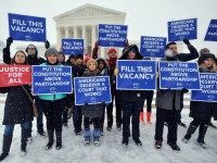 WASHINGTON, DC - FEBRUARY 15: People For the American Way activists rally outside of the Supreme Court, calling on Congress to give fair consideration to President Obama's nominee to the Supreme Court of the United States on February 15, 2016 in Washington, DC. (Photo by Larry French/Getty Images for People For The American Way)