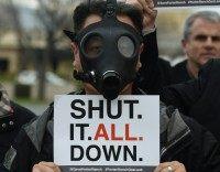 A resident wears a gas mask as he joins others in a protest outside a meeting of the Air Quality Management Board over the gas leak in Porter Ranch, California on January 23, 2016