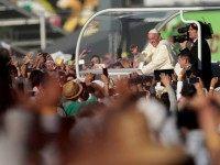 Pope Francis waves from the popemobile in Ciudad Juarez, Chihuahua state, Mexico on February 17, 2016. Throngs gathered at Mexico's border with the United States on Wednesday for a huge mass with Pope Francis highlighting the plight of migrants -- a hot-button issue on the US presidential campaign trail. AFP PHOTO/ Pedro PARDO / AFP / Pedro PARDO (Photo credit should read