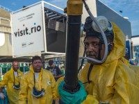 Municipal agents spray anti Zika mosquitos chimical product at the sambadrome in Rio de Janeiro, on January 26, 2016. 
Brazil is mobilizing more than 200,000 troops to go "house to house" in the battle against Zika-carrying mosquitoes, blamed for causing horrific birth defects in a major regional health scare, a report said Monday. / AFP / CHRISTOPHE SIMON        (Photo credit should read CHRISTOPHE SIMON/AFP/Getty Images)