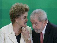 Brazil’s President Dilma Rousseff talks with former President Luiz Inacio Lula da Silva during his swearing-in ceremony as the chief of staff, at the Planalto presidential palace, in Brasilia, Brazil, Thursday, March 17, 2016. Silva was sworn in as his successor’s chief of staff on Thursday and Rousseff insisted he would help put the troubled country back on track and denounced attempts to oust her. (AP Photo/Eraldo Peres)