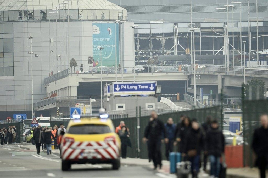 People are evacuated from Brussels Airport, in Zaventem, on March 22, 2016. after at least 13 people have been killed by two explosions in the departure hall of Brussels Airport. / AFP / Belga / VIRGINIE LEFOUR / Belgium OUT (Photo credit should read VIRGINIE LEFOUR/AFP/Getty Images)