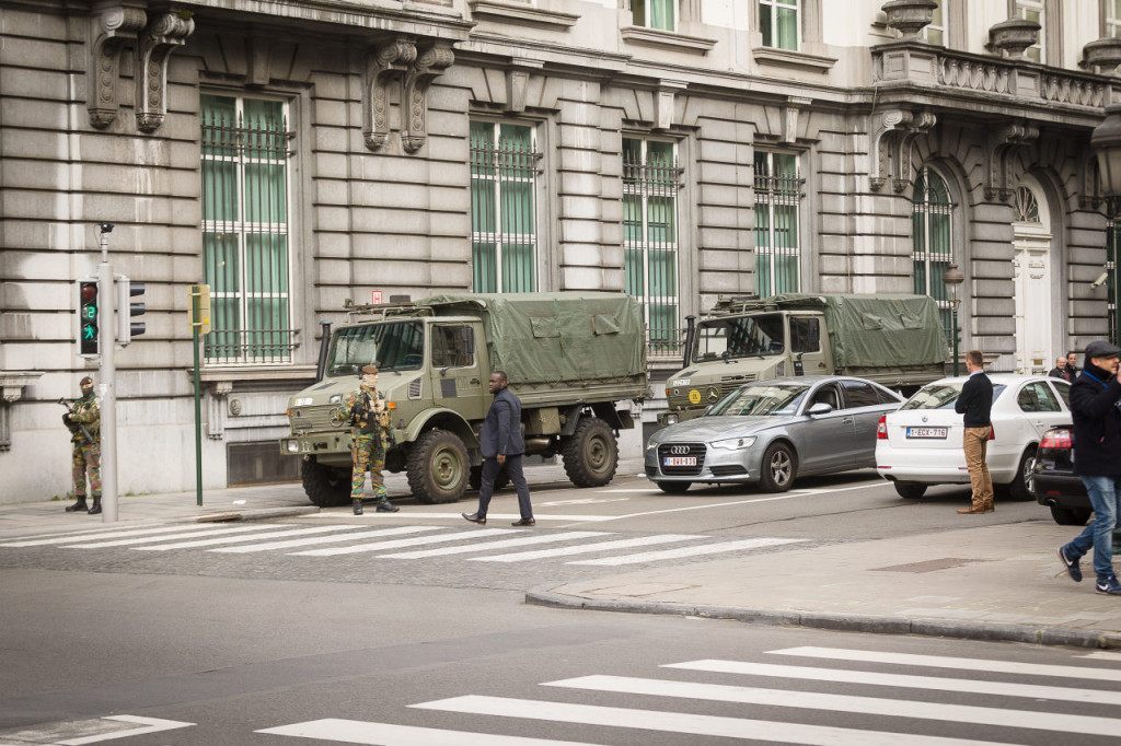 Belgian servicemen block the road close to a meeting of the National Security Council at the Prime Minister's office, in Brussels, on March 22, 2016, after a string of explosions rocked Brussels airport and a city metro station, killing at least 21 people, as Belgium raised its terror threat to the maximum level. The blasts come days after the dramatic arrest in Brussels on March 18 of Salah Abdeslam, the prime suspect in the Paris terror attacks that killed 130 people in November, after four months on the run. / AFP / Belga / James Arthur Gekiere / Belgium OUT (Photo credit should read JAMES ARTHUR GEKIERE/AFP/Getty Images)