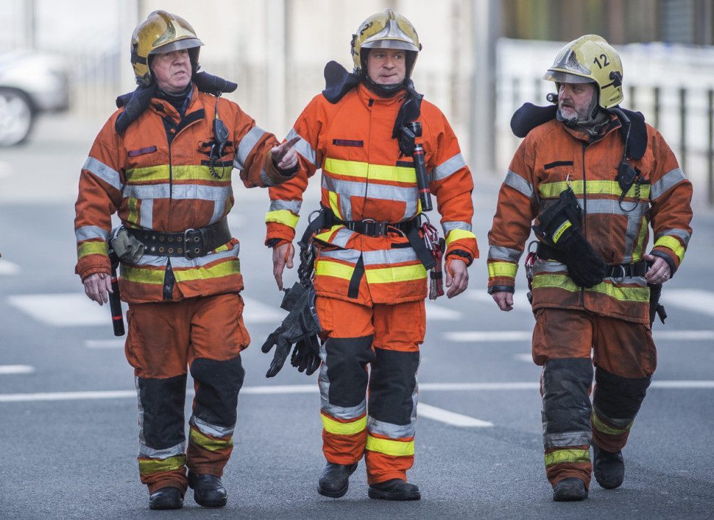 Firefighters arrive at a security perimeter set in the Rue de la Loi near the Maalbeek subway station, in Brussels, on March 22, 2016, after an explosion killed around 10 people, according to spokesman of Brussels' fire brigade A string of explosions rocked Brussels airport and a city metro station on Tuesday, killing at least 13 people, according to media reports, as Belgium raised its terror threat to the maximum level. / AFP / Belga / LAURIE DIEFFEMBACQ / Belgium OUT (Photo credit should read LAURIE DIEFFEMBACQ/AFP/Getty Images)