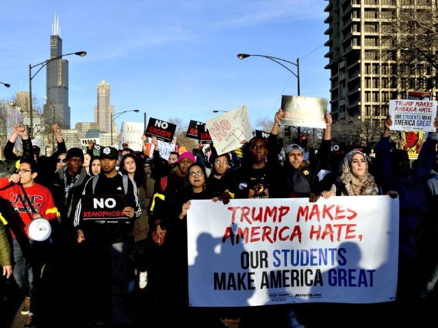 Protestors march in Chicago on Friday, March 11, 2016, before a rally with Republican presidential candidate Donald Trump at the University of Illinois-Chicago. (AP Photo/Matt Marton)