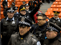 Chicagio police arrive as anti-Trump protesters take over during a Trump rally at the UIC Pavilion in Chicago on March 11, 2016. Republican White House hopeful Donald Trump cancelled his appearance at a Chicago rally Friday amid extraordinary scenes of chaos, with hundreds of protesters clashing with the frontrunner's supporters and police struggling to maintain order. / AFP / Tasos Katopodis 2016 (Photo credit should read